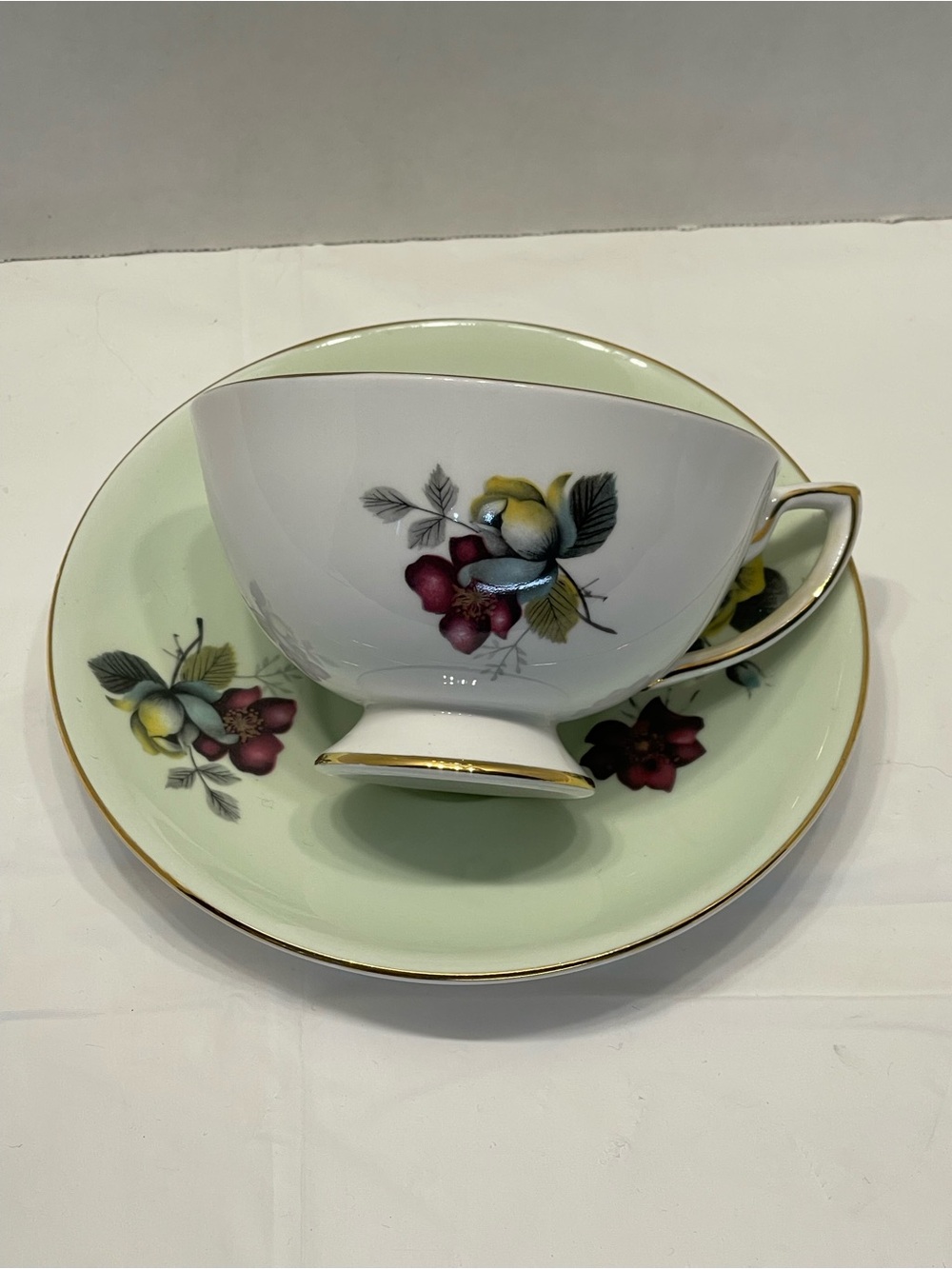 Porcelain Teacup & Saucer Set in Pale Green with Floral Accents